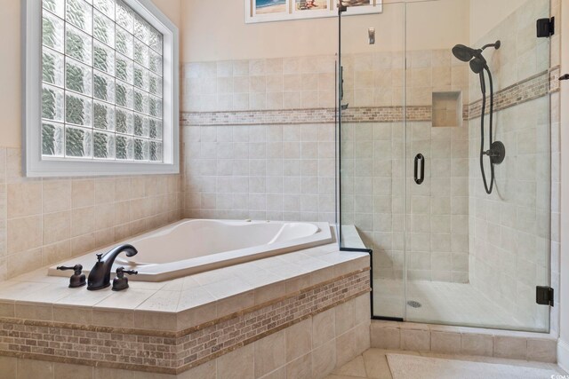 1501 Harbor Dr, North Myrtle Beach, SC 29582 - bathroom featuring a garden tub, a stall shower, and tile patterned flooring