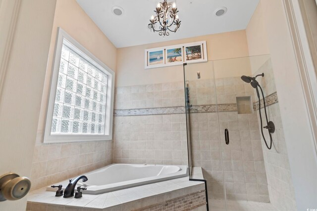 1501 Harbor Dr, North Myrtle Beach, SC 29582 - bathroom featuring a bath, a stall shower, and a chandelier