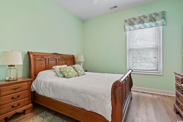 1501 Harbor Dr, North Myrtle Beach, SC 29582 - bedroom with multiple windows, light wood finished floors, baseboards, and ceiling fan