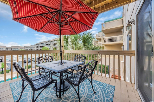 9661 Shore Dr Unit B7-29, Myrtle Beach, SC 29572 - wooden terrace with outdoor dining space