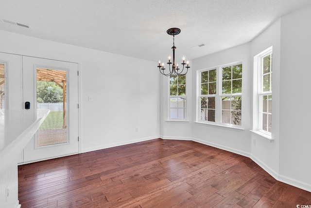 553 Fox Chase Dr, Conway, SC 29527 - unfurnished dining area with a chandelier, dark wood finished floors, baseboards, and a textured ceiling