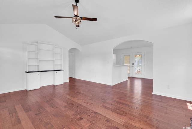 553 Fox Chase Dr, Conway, SC 29527 - unfurnished living room with arched walkways, a ceiling fan, dark wood-style floors, lofted ceiling, and french doors