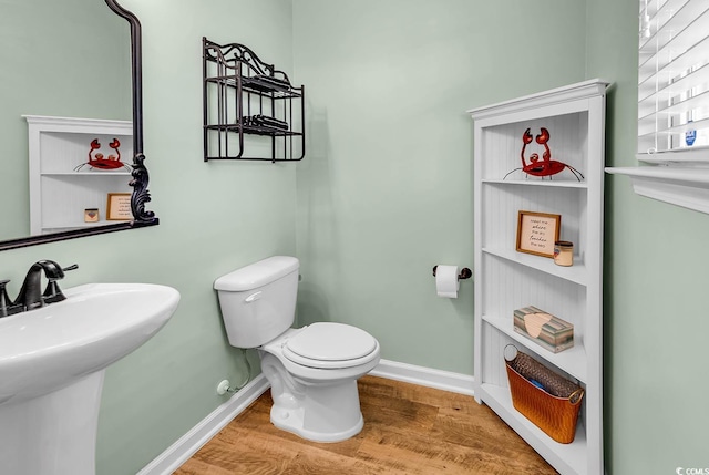 408 Carmello Cir, Conway, SC 29526 - half bath with wood finished floors, baseboards, toilet, and a sink