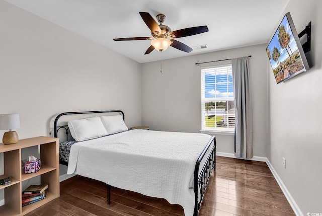 408 Carmello Cir, Conway, SC 29526 - bedroom featuring dark wood-type flooring, baseboards, and a ceiling fan