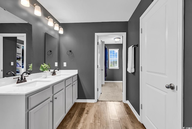 408 Carmello Cir, Conway, SC 29526 - full bathroom with wood finished floors, double vanity, and baseboards