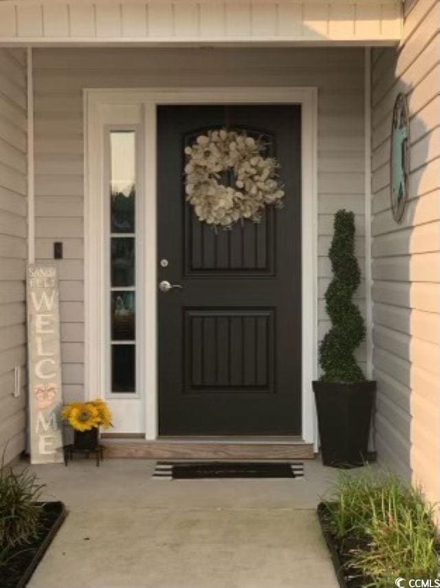 387 Blue Rock Dr, Longs, SC 29568 - doorway to property featuring covered porch