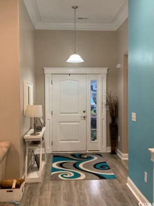 387 Blue Rock Dr, Longs, SC 29568 - foyer entrance with wood finished floors, crown molding, and baseboards