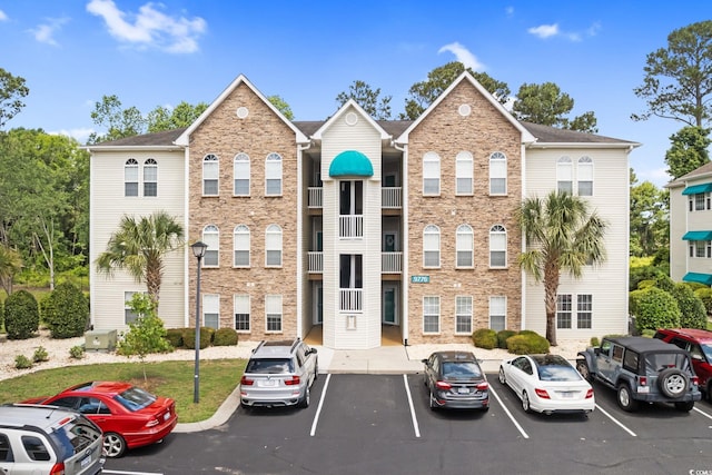 9776 Leyland Dr Unit 2, Myrtle Beach, SC 29572 - view of building exterior with uncovered parking
