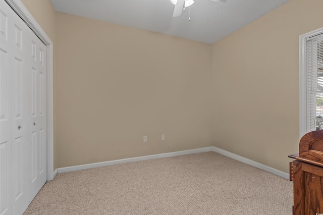 100 Lazy Willow Ln Unit 103, Myrtle Beach, SC 29588 - unfurnished bedroom featuring carpet, baseboards, a closet, and a ceiling fan