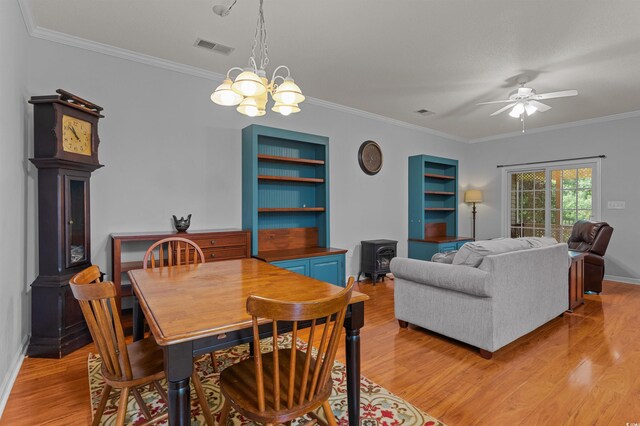 100 Lazy Willow Ln Unit 103, Myrtle Beach, SC 29588 - dining room featuring light wood-style floors, crown molding, a chandelier, a ceiling fan, and baseboards
