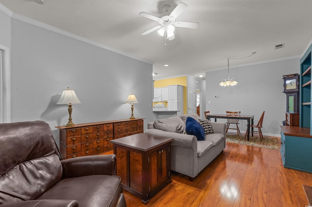 100 Lazy Willow Ln Unit 103, Myrtle Beach, SC 29588 - living room with a ceiling fan, ornamental molding, hardwood / wood-style floors, a chandelier, and baseboards
