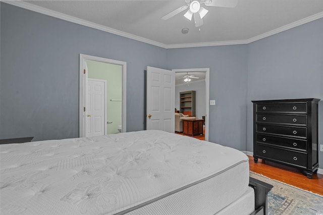 100 Lazy Willow Ln Unit 103, Myrtle Beach, SC 29588 - bedroom featuring wood finished floors, ornamental molding, baseboards, a ceiling fan, and connected bathroom