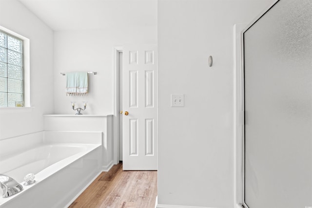 396 Mckendree Ln, Myrtle Beach, SC 29579 - bathroom with wood finished floors, a garden tub, a shower stall, and baseboards