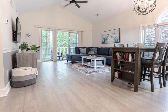 698 Riverwalk Dr Unit 304, Myrtle Beach, SC 29579 - living area featuring a ceiling fan, wood finished floors, high vaulted ceiling, and a chandelier