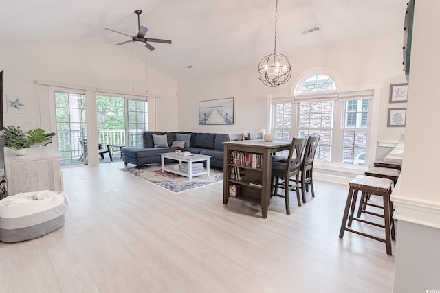 698 Riverwalk Dr Unit 304, Myrtle Beach, SC 29579 - dining space with high vaulted ceiling, a chandelier, plenty of natural light, wood finished floors, and ceiling fan