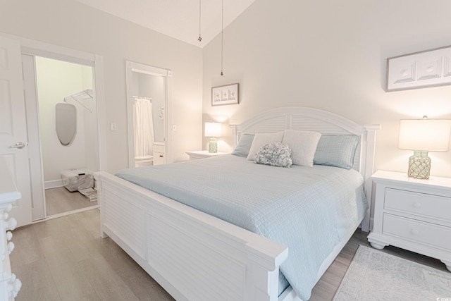 698 Riverwalk Dr Unit 304, Myrtle Beach, SC 29579 - bedroom featuring light wood-style floors and ensuite bathroom