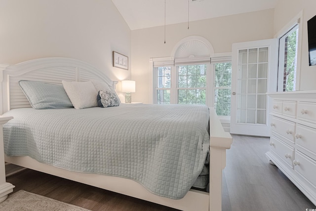 698 Riverwalk Dr Unit 304, Myrtle Beach, SC 29579 - bedroom with wood finished floors, vaulted ceiling, and multiple windows