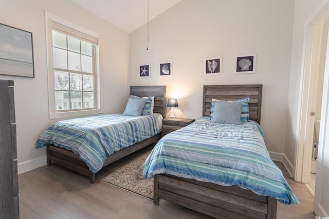 698 Riverwalk Dr Unit 304, Myrtle Beach, SC 29579 - bedroom featuring lofted ceiling, wood finished floors, and baseboards