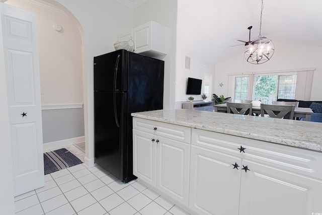 698 Riverwalk Dr Unit 304, Myrtle Beach, SC 29579 - kitchen with freestanding refrigerator, light stone counters, arched walkways, a chandelier, and lofted ceiling
