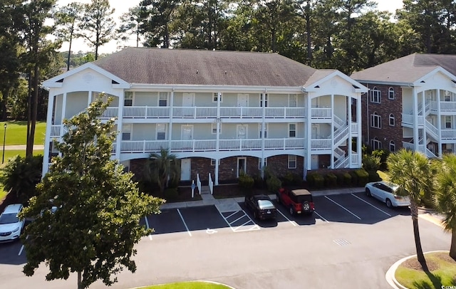 698 Riverwalk Dr Unit 304, Myrtle Beach, SC 29579 - view of property featuring uncovered parking