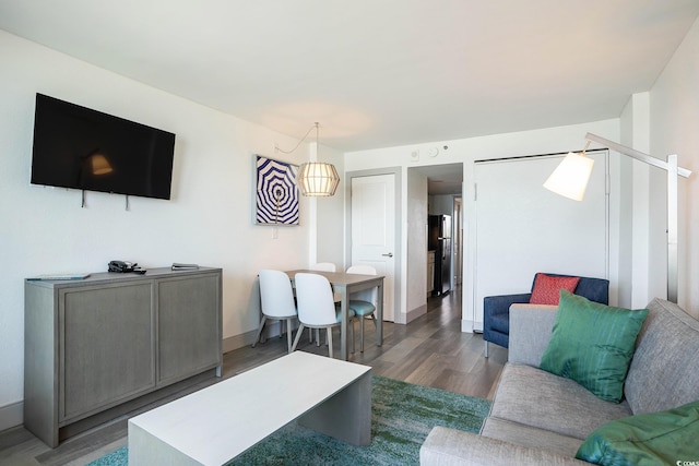 2401 S Ocean Blvd Unit 557, Myrtle Beach, SC 29577 - living room with wood finished floors and baseboards