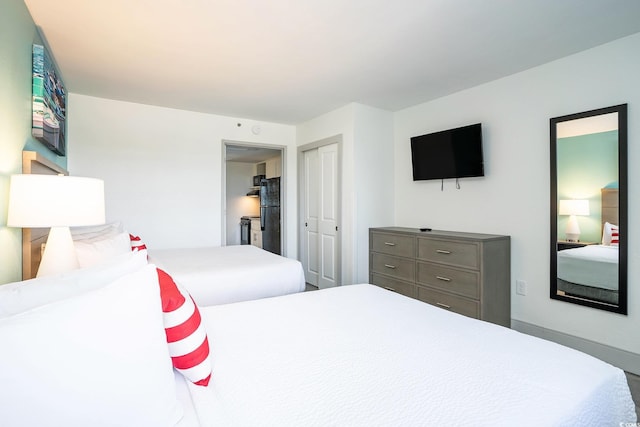 2401 S Ocean Blvd Unit 557, Myrtle Beach, SC 29577 - bedroom with freestanding refrigerator and a closet