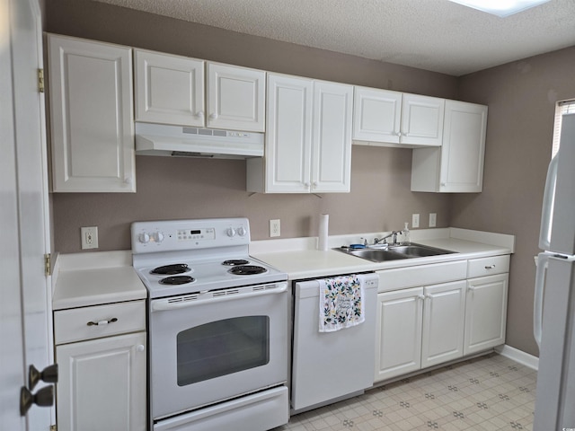 300-J Myrtle Greens Dr Unit J, Conway, SC 29526 - kitchen with under cabinet range hood, white appliances, a sink, white cabinetry, and light countertops