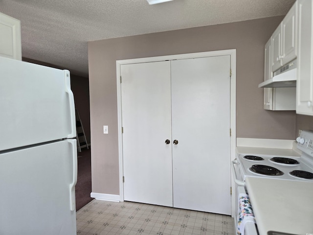 300-J Myrtle Greens Dr Unit J, Conway, SC 29526 - kitchen with white appliances, under cabinet range hood, light flooring, white cabinets, and a textured ceiling