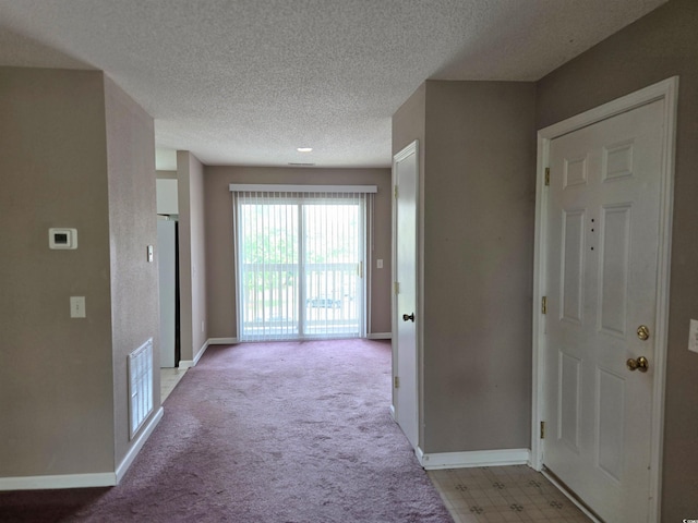 300-J Myrtle Greens Dr Unit J, Conway, SC 29526 - hall featuring a textured ceiling, baseboards, and light carpet