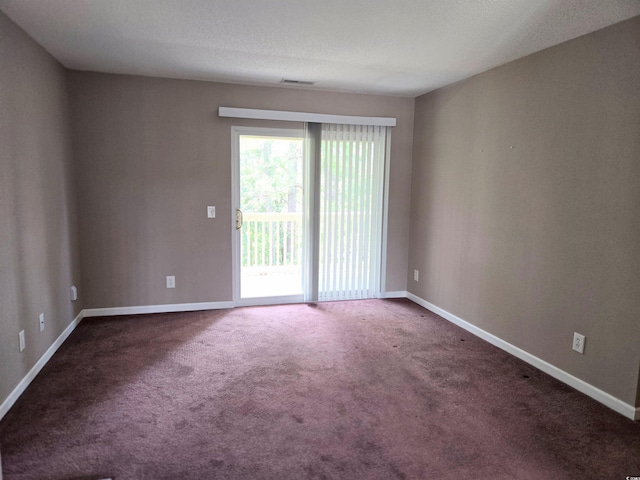 300-J Myrtle Greens Dr Unit J, Conway, SC 29526 - spare room featuring dark colored carpet and baseboards
