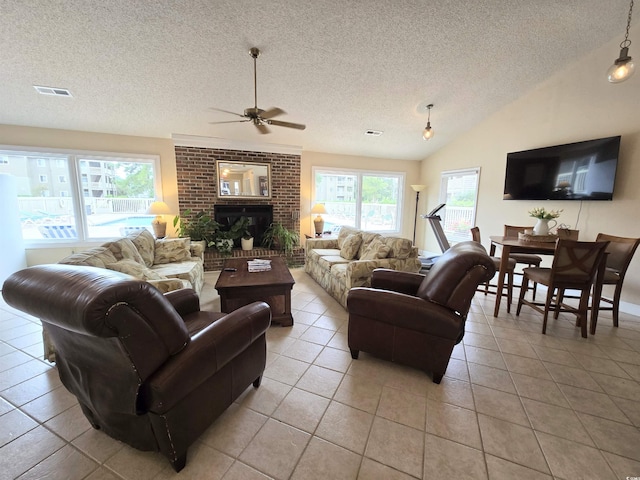 300-J Myrtle Greens Dr Unit J, Conway, SC 29526 - living area featuring a textured ceiling, ceiling fan, light tile patterned floors, vaulted ceiling, and a brick fireplace