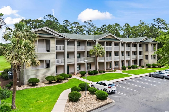 562 Blue Stem Dr Unit 54-F, Pawleys Island, SC 29585 - view of apartment building / complex featuring uncovered parking