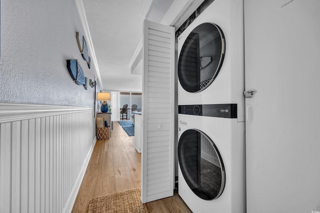 1012 N Waccamaw Dr Unit 1107, Murrells Inlet, SC 29576 - laundry area with estacked washer and dryer and wood finished floors