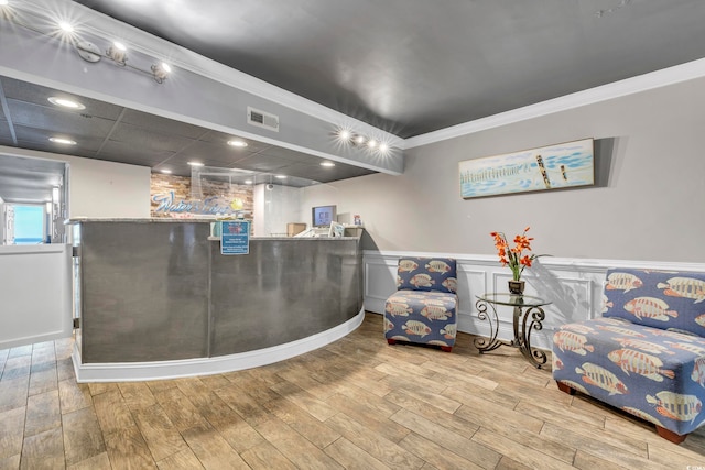 1012 N Waccamaw Dr Unit 1107, Murrells Inlet, SC 29576 - reception with a wainscoted wall, ornamental molding, a community bar, and recessed lighting