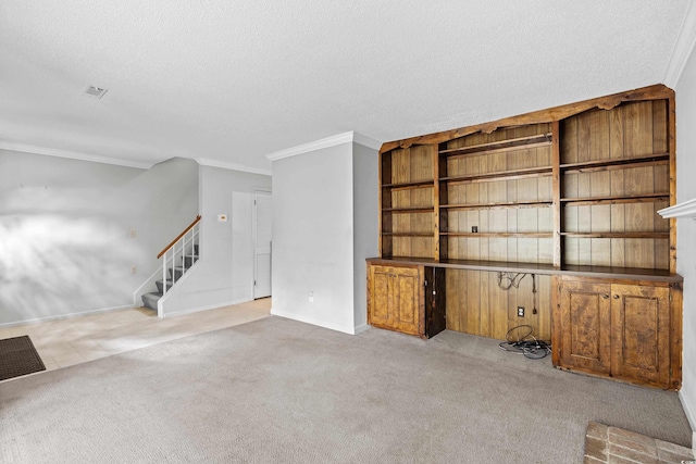 308 76th Ave N Unit 5, Myrtle Beach, SC 29572 - unfurnished living room featuring a textured ceiling, crown molding, stairs, carpet floors, and baseboards