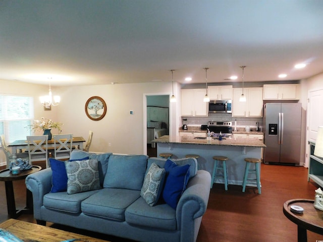 401 Quinta St, Longs, SC 29568 - living area with dark wood-style flooring, a chandelier, and recessed lighting