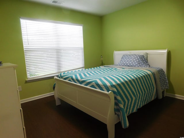 401 Quinta St, Longs, SC 29568 - bedroom featuring baseboards and dark wood-style flooring