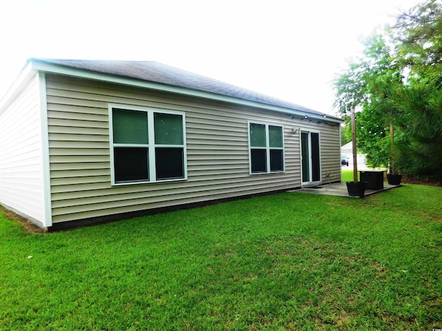 401 Quinta St, Longs, SC 29568 - rear view of house featuring a lawn and a patio area