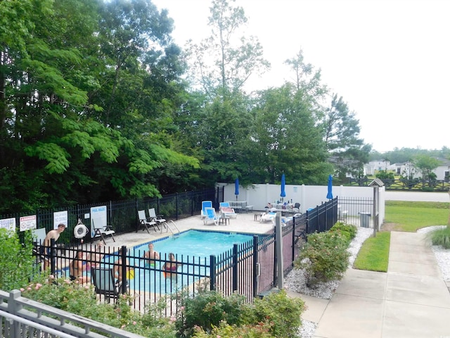 401 Quinta St, Longs, SC 29568 - community pool featuring a patio and view of scattered trees