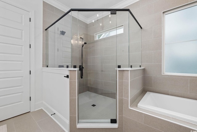 1058 E Isle Of Palms Ave, Myrtle Beach, SC 29579 - bathroom with a garden tub, healthy amount of natural light, a shower stall, tile patterned floors, and ornamental molding
