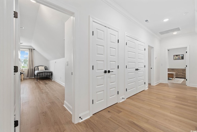 1058 E Isle Of Palms Ave, Myrtle Beach, SC 29579 - corridor with light wood finished floors, crown molding, recessed lighting, and vaulted ceiling