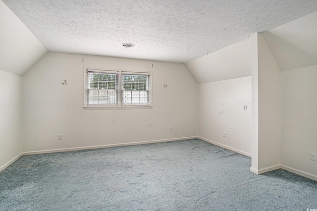 1700 Longleaf Dr, Myrtle Beach, SC 29575 - bonus room featuring lofted ceiling, carpet, and a textured ceiling