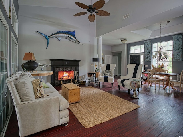 1635 Southwood Dr, Surfside Beach, SC 29575 - living area with ceiling fan, a lit fireplace, wood finished floors, a high ceiling, and decorative columns