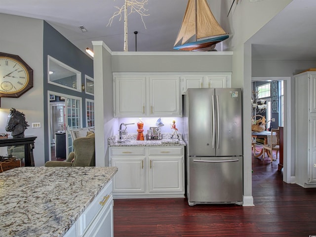 1635 Southwood Dr, Surfside Beach, SC 29575 - kitchen featuring freestanding refrigerator, dark wood-style flooring, light stone counters, and white cabinets