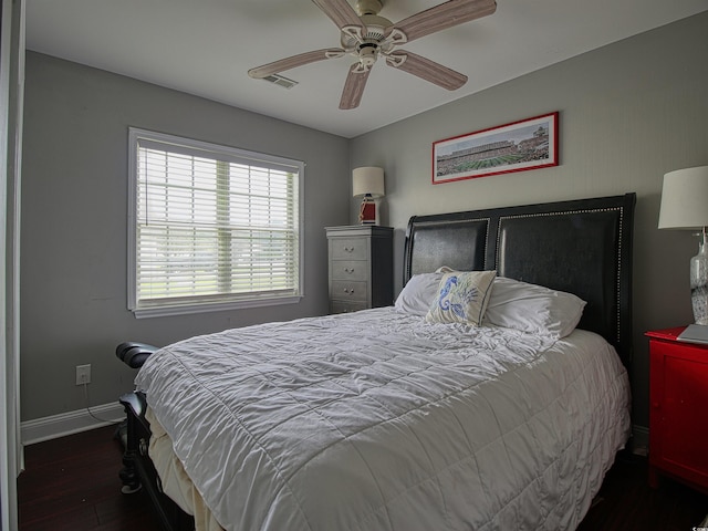 1635 Southwood Dr, Surfside Beach, SC 29575 - bedroom with dark wood finished floors and a ceiling fan
