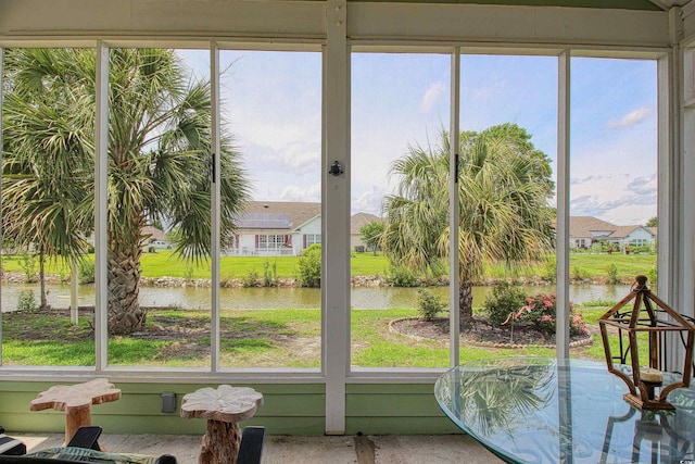 1635 Southwood Dr, Surfside Beach, SC 29575 - sunroom featuring a water view, plenty of natural light, and a residential view
