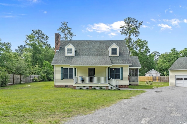 124 Wicklow Way, Pawleys Island, SC 29585 - new england style home with crawl space, a porch, a chimney, a shingled roof, and driveway