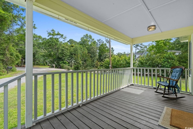 124 Wicklow Way, Pawleys Island, SC 29585 - wooden deck featuring view of scattered trees and a yard