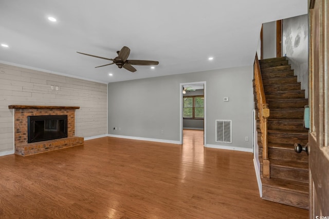 124 Wicklow Way, Pawleys Island, SC 29585 - unfurnished living room featuring ceiling fan, wood finished floors, stairway, baseboards, and recessed lighting