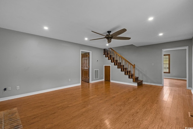 124 Wicklow Way, Pawleys Island, SC 29585 - unfurnished living room featuring a ceiling fan, recessed lighting, light wood-type flooring, stairway, and baseboards